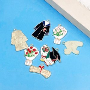 Colorful graduation charms with doctoral cap, flower bouquet and graduate scroll pendants