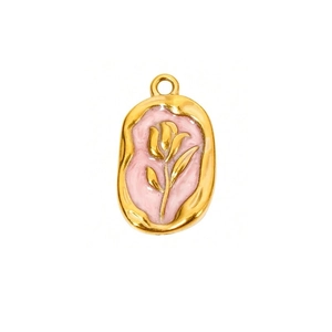 Macro detail of French vintage oval pendant with pink enamel and golden tulip relief