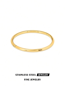 Bracelet jonc en acier inoxydable plaqué or 18k avec détail de fermoir poli