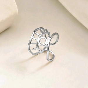 Bague ouverte en acier inoxydable poli argenté avec un motif ajouré en forme d'œil