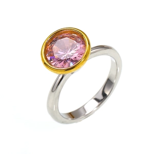 Fashionable luxury titanium ring with round pink zircon in elegant gold bezel setting