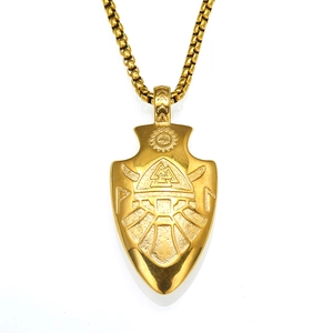 Detail of golden Viking arrow pendant featuring Valknut symbol and Norse rune engravings