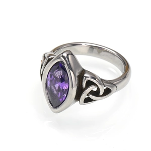 Detail of vintage ring with purple marquise gem and Celtic knot engraving on silver band