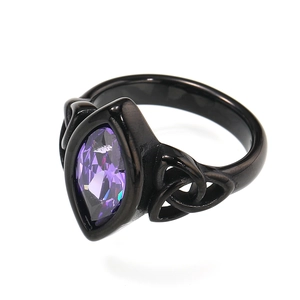 Detailed macro view of purple marquise gemstone set in black gothic celtic knot ring