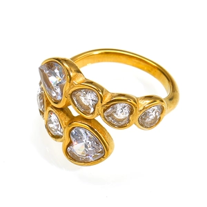 Detailed close-up of heart-shaped zircon stones on a gold-plated stainless steel ring