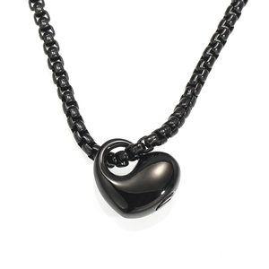 Detail of black heart urn pendant with openable side for ashes or perfume