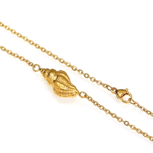 Macro shot of gold conch shell pendant necklace with detailed texture and lobster clasp