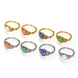 Set of vintage filigree stainless steel rings with colorful oval gemstones in gold and silver