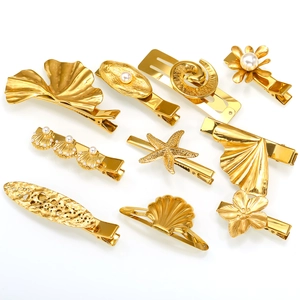 10-piece gold ocean theme hair clip set featuring starfish, shells and pearls
