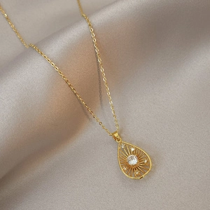 Elegant gold teardrop pendant necklace with sparkling crystal inlay and delicate O-chain