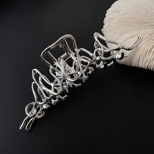 Irregular liquid metal silver hair claw clip with lava style design for women
