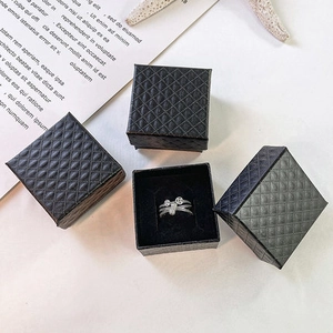 Silver multi-layered coin ring with premium black quilted jewelry storage boxes