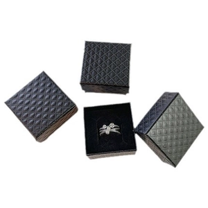 Elegant black quilted jewelry gift boxes with an ethnic style silver ring inside