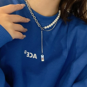 Layered hip hop necklace with silver chains, pearls, and a ruler-style pendant design