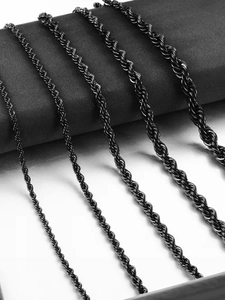 Detail of five different widths of black stainless steel rope chains on a display stand