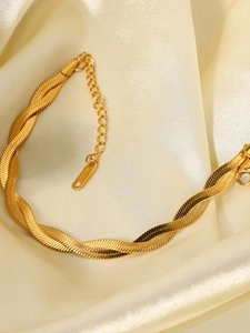 Macro view of double-layer twisted snake chain bracelet in gold-plated titanium steel
