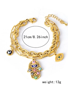 Detail view of gold layered Hamsa and Evil Eye bracelet showing 21cm length and 13g weight