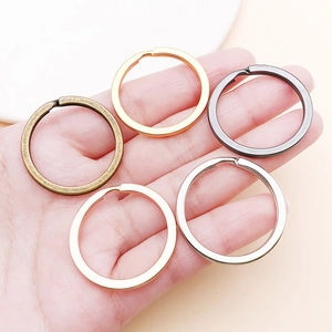 Macro shot of 5 colorful 30mm flat round metal key rings for DIY jewelry accessories