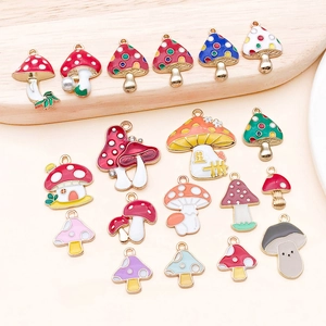 Detailed close-up of colorful enamel mushroom charms for DIY jewelry and accessories