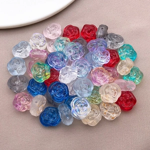 Close-up of colorful rose-shaped glass beads for DIY jewelry making and handicraft