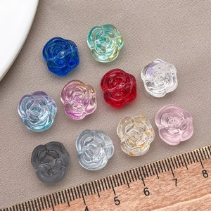 Macro shot of 10-color rose-shaped glass beads for handmade jewelry 15mm floral charms