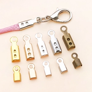 Macro shot of assorted metal cord ends and lobster clasps for DIY jewelry making