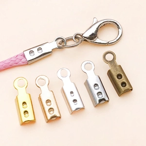 Macro detail of multi-color jewelry cord crimps and lobster clasps for DIY crafts