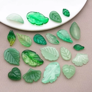 Assorted green glass leaf pendants including ginkgo and maple leaves for DIY jewelry