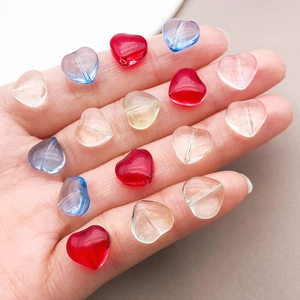 Macro detail of 10mm colorful heart-shaped glass beads for DIY jewelry making