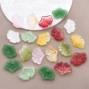 Macro view of multi-color ginkgo leaf pendants with top holes for DIY jewelry making
