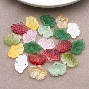 Macro shot of 15x20mm glass ginkgo leaf charms showing detailed texture and vivid colors