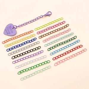 Macro view of colorful lacquered iron extension chains with lobster clasps for DIY jewelry