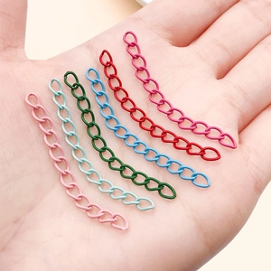 Colorful 5cm metal extension chains for DIY jewelry making shown held in hand