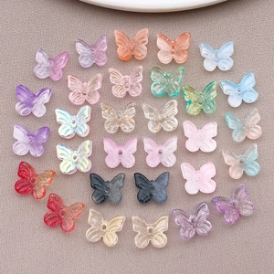 Colorful 3D butterfly glass beads on beige fabric for DIY handmade jewelry crafts