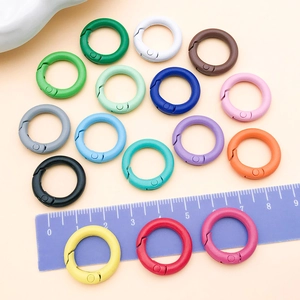 Detail of 20mm colorful spray-painted zinc alloy spring rings for bags and DIY crafts