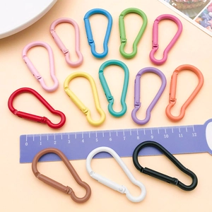 Close-up of colorful 47x24mm gourd-shaped aluminum alloy carabiners in matte finish