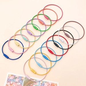 Detailed view of colorful wire keychain rings with secure threaded locking mechanisms