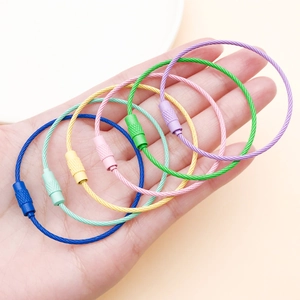Macro detail of colorful 50mm painted wire keychains with secure screw lock connectors