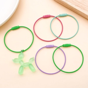 Detailed view of candy color steel wire keychains with a green resin balloon dog pendant