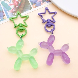 Chiusura a forma di stella e cani palloncino in resina glitterata verdi e viola