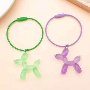 Detail view of colorful resin balloon dog keychains with matching wire loop connectors