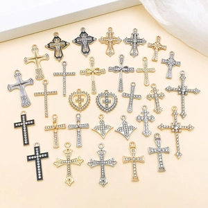 Assorted gold and silver cross pendants with rhinestones and enamel for jewelry making