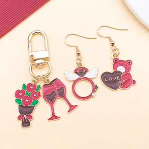Detail view of Valentine's Day alloy charms featuring heart bouquet and ring designs