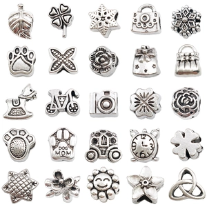 Vue détaillée de 25 perles en alliage d'argent vintage avec motifs feuilles et animaux