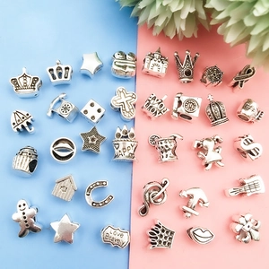Detailed view of assorted silver alloy DIY charms with vintage texture for bracelets