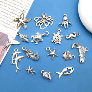 Vintage silver ocean animal charms kit featuring starfish, seahorse, and dolphin pendants