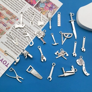 Assorted vintage silver alloy tool pendants including saw and ruler for jewelry DIY
