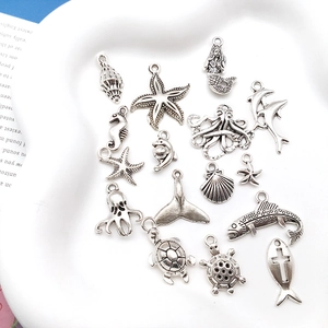 Assorted vintage silver sea animal charms including starfish and seahorses for DIY jewelry