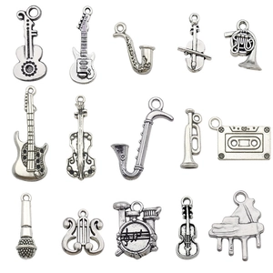 Set of 14 antique silver musical instrument alloy charms including guitar and violin