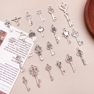 Assorted vintage silver alloy key pendants for DIY jewelry and necklace crafting